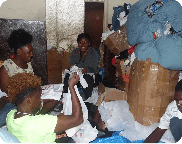 Our Meraki Team gathering clothes supplies for kids.